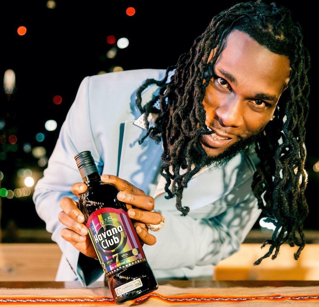 Burna Boy holding Havana Club Limited Edition bottle